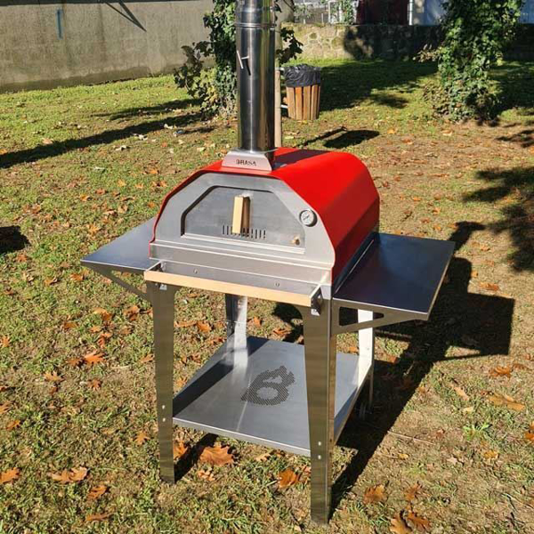 Picture of red Brasa pizza oven with trolley stand