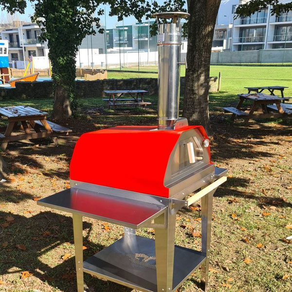 Picture of red Brasa pizza oven with trolley stand