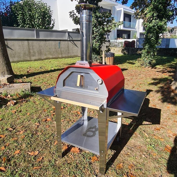 Picture of red Brasa pizza oven with trolley stand