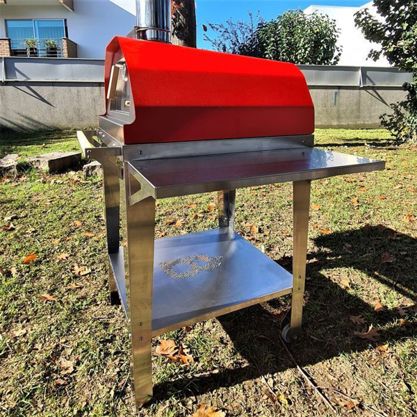 Picture of red Brasa pizza oven with trolley stand